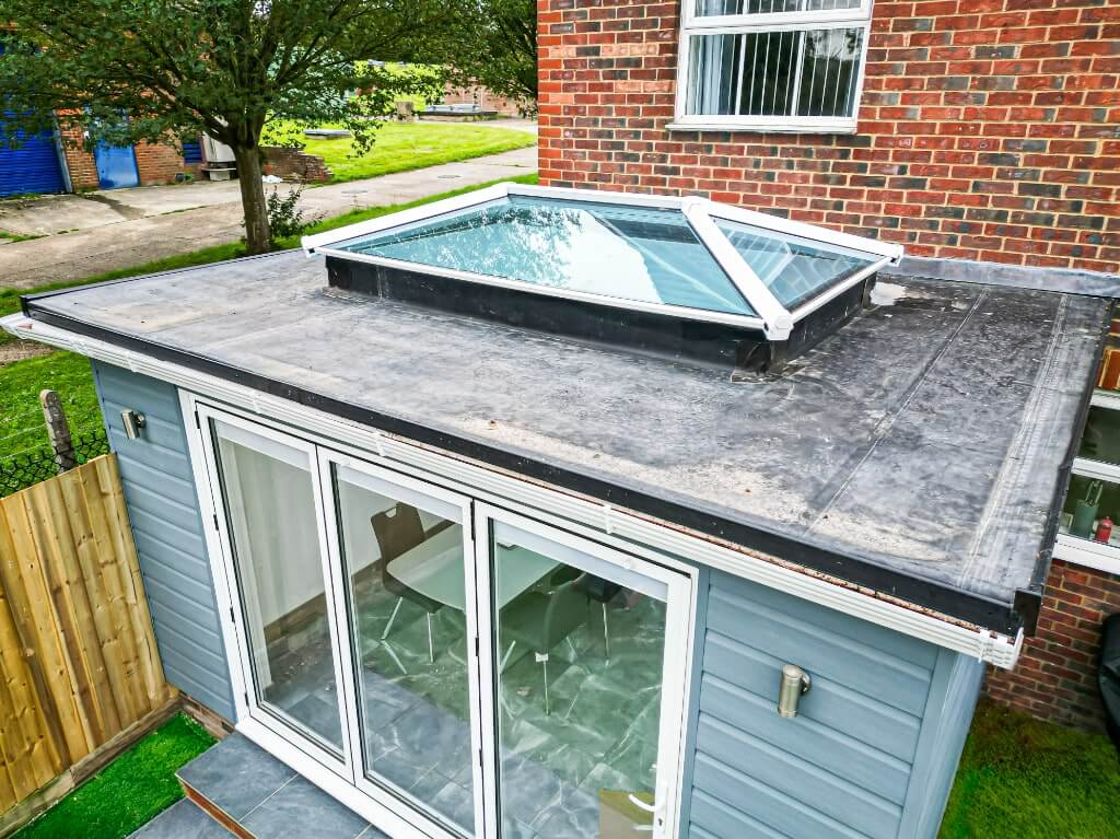 Extension with Blue Cladding and a Flat Roof